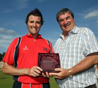 Kyle McCallan receives the Ulster Bank Man of the Match Award from Ireland manager Roy Torrens following Waringstown's win over Instonians in the Challenge Cup (c)CricketEurope